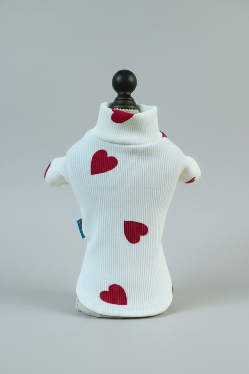 White sweater with red hearts on a light background